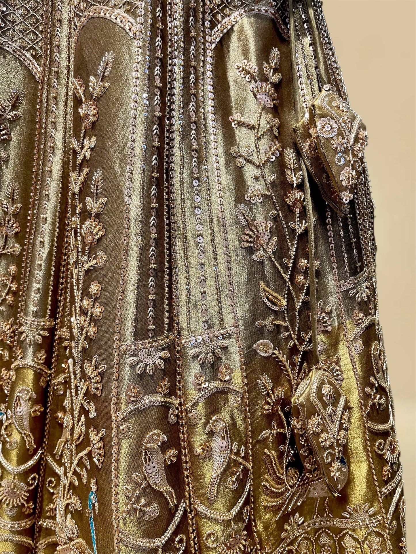 ANTIQUE GOLDEN TISSUE LEHENGA EMBELLISHED WITH SEQUINS, CUTDANA & RESHAM WORK