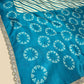 TURQUOISE COLOUR ART SILK LEHERIYA–BANDHANI PRINTED SAREE WITH LACE BORDER