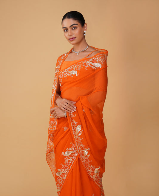 ORANGE CHIFFON SAREE WITH AARI PIPE, AND SEQUINS HAND EMBROIDERED BORDER & MOTIFS