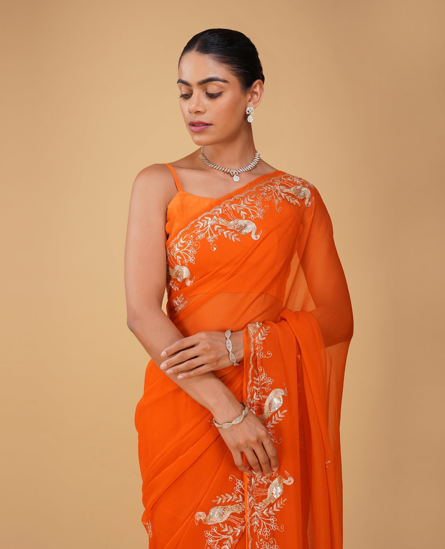 ORANGE CHIFFON SAREE WITH AARI PIPE, AND SEQUINS HAND EMBROIDERED BORDER & MOTIFS