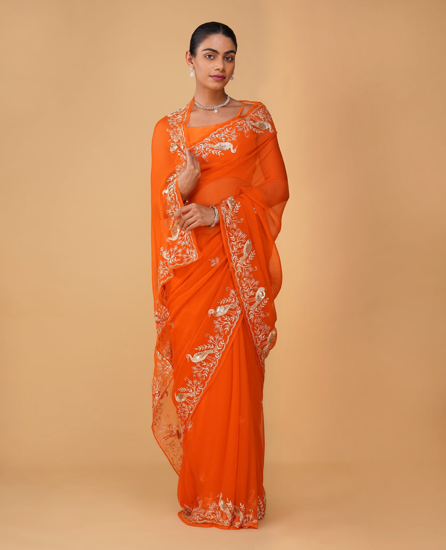 ORANGE CHIFFON SAREE WITH AARI PIPE, AND SEQUINS HAND EMBROIDERED BORDER & MOTIFS