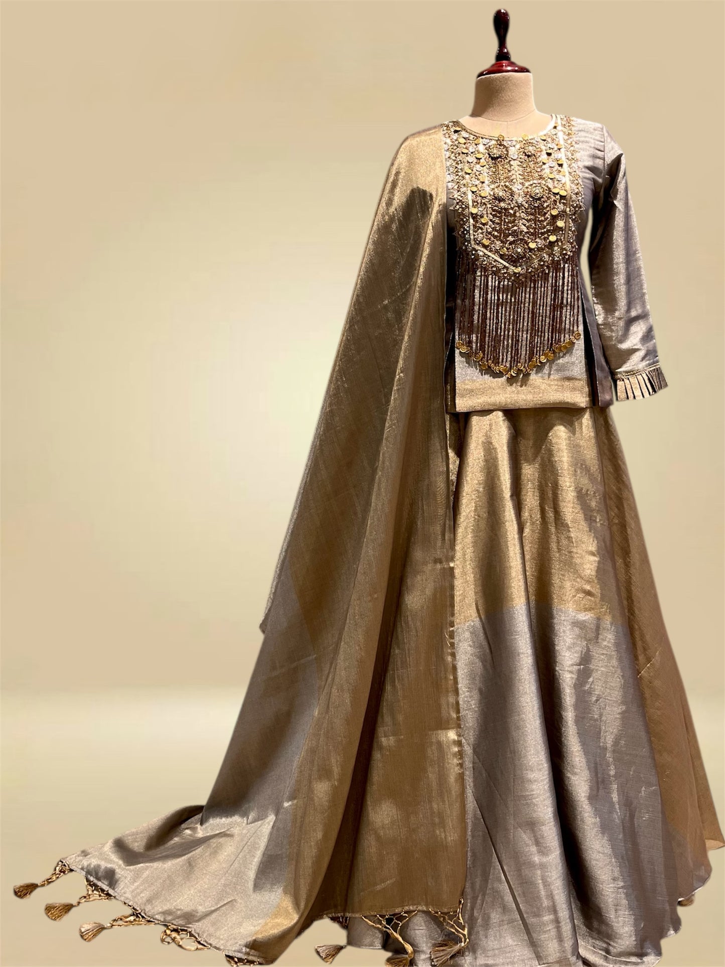 SILVER AND ANTIQUE GOLD CHANDERI TISSUE LEHENGA SET WITH SEQUIN & CUTDANA EMBROIDERED SHORT KURTI AND DUPATTA