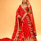 RED BRIDAL WEDDING LEHENGA WITH THREE-PANEL DESIGN, 6-METER FLAIR, DOUBLE DUPATTA, POTLI & EMBROIDERED TASSELS