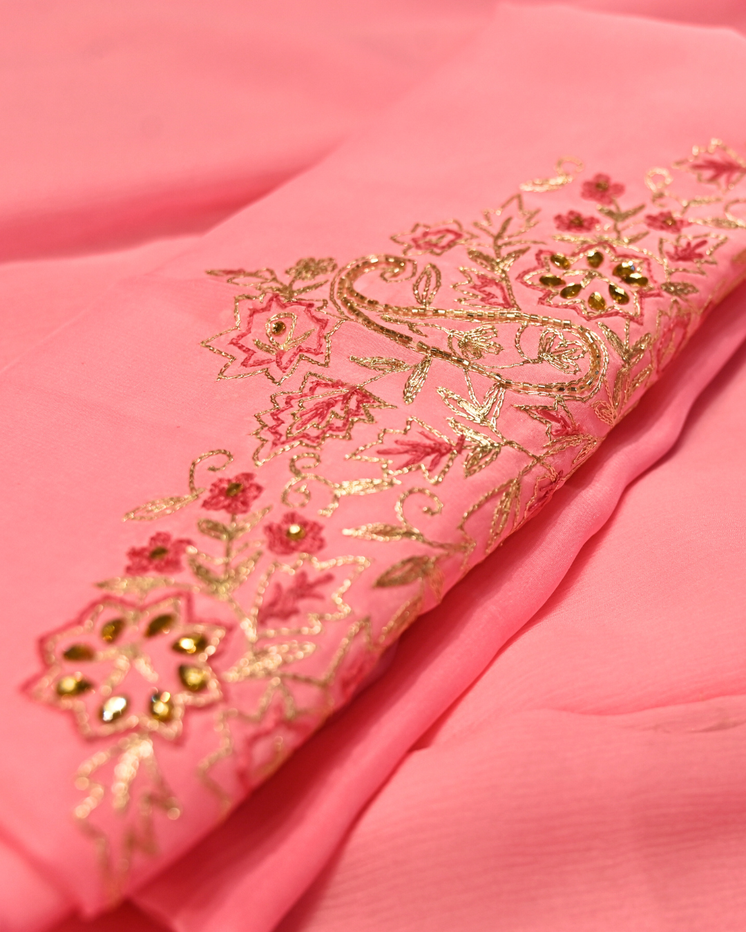 ELECTRIC BABY PINK COLOUR ZARI AARI & RESHAM EMBROIDERED BORDER, BOOTIES IN PLANT BASED, PINK COLOUR CHIFFON SAREE