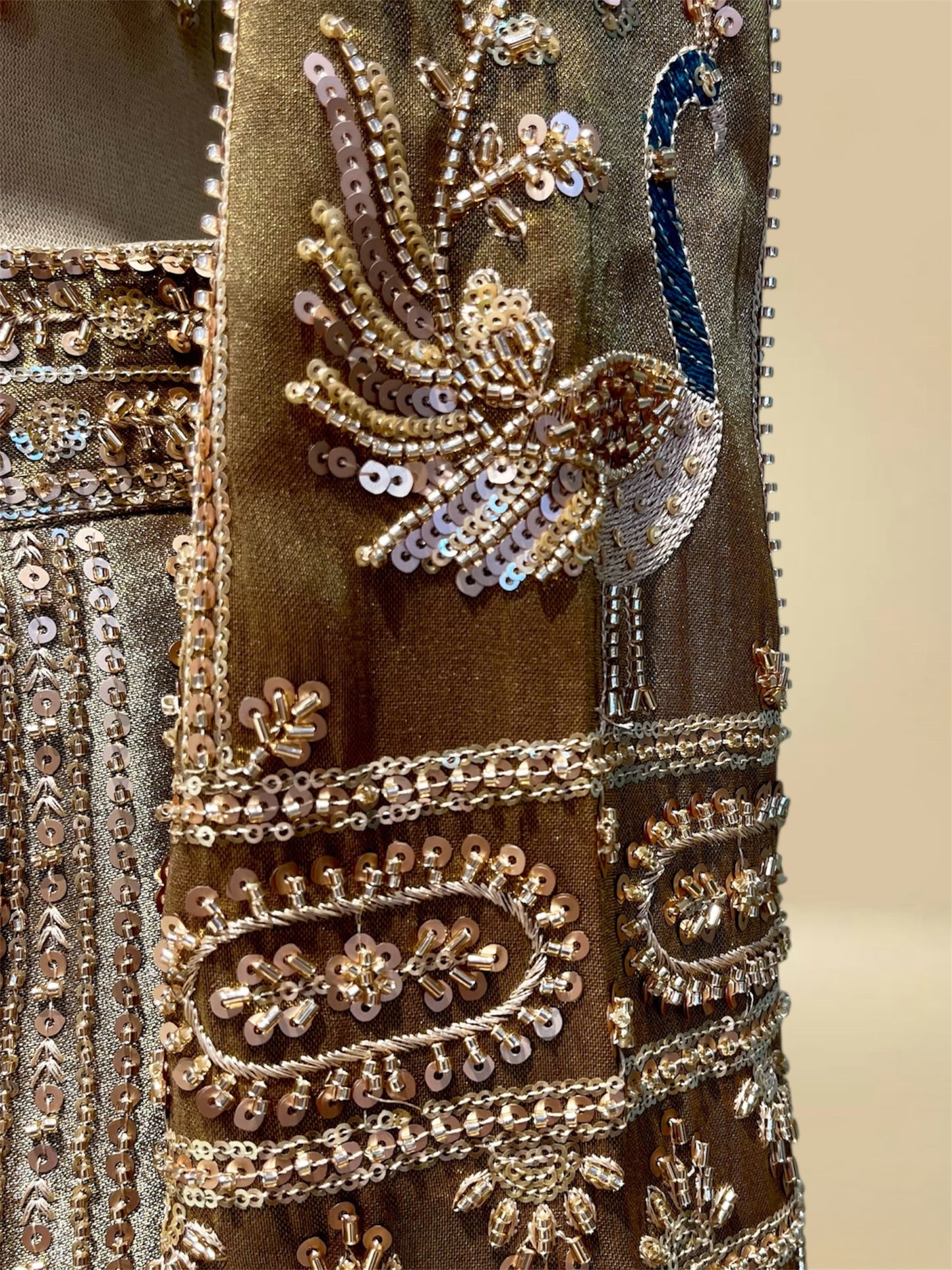 ANTIQUE GOLDEN TISSUE LEHENGA EMBELLISHED WITH SEQUINS, CUTDANA & RESHAM WORK