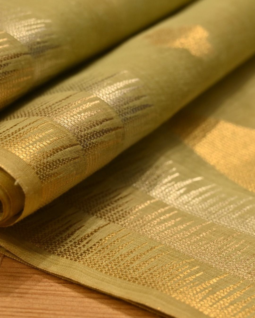 PASTEL PISTA GREEN MUNGA CHANDERI SAREE WITH TEMPLE BORDER AND SILVER-GOLDEN BOOTIES