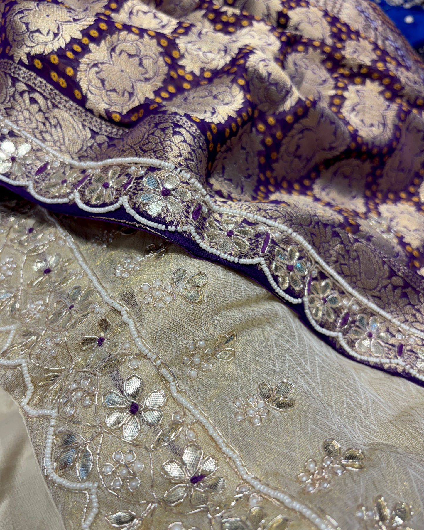 IVORY-PURPLE COLOUR TISSUE GEORGETTE BANDHANI LEHENGA EMBELLISHED WITH GOTA PATTI & ZARDOZI WORK