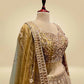 ANTIQUE GOLDEN TISSUE LEHENGA EMBELLISHED WITH SEQUINS, CUTDANA & RESHAM WORK