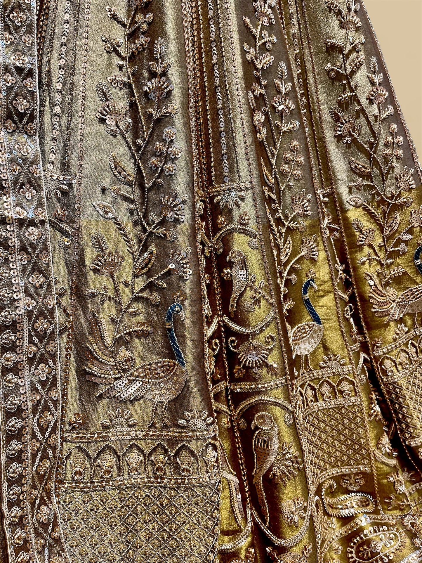 ANTIQUE GOLDEN TISSUE LEHENGA EMBELLISHED WITH SEQUINS, CUTDANA & RESHAM WORK