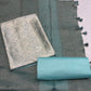 DUSTY TEAL BROCADE UNSTITCHED SUIT WITH CRUSHED TISSUE DUPATTA &CHANDERI SILK BOTTOM