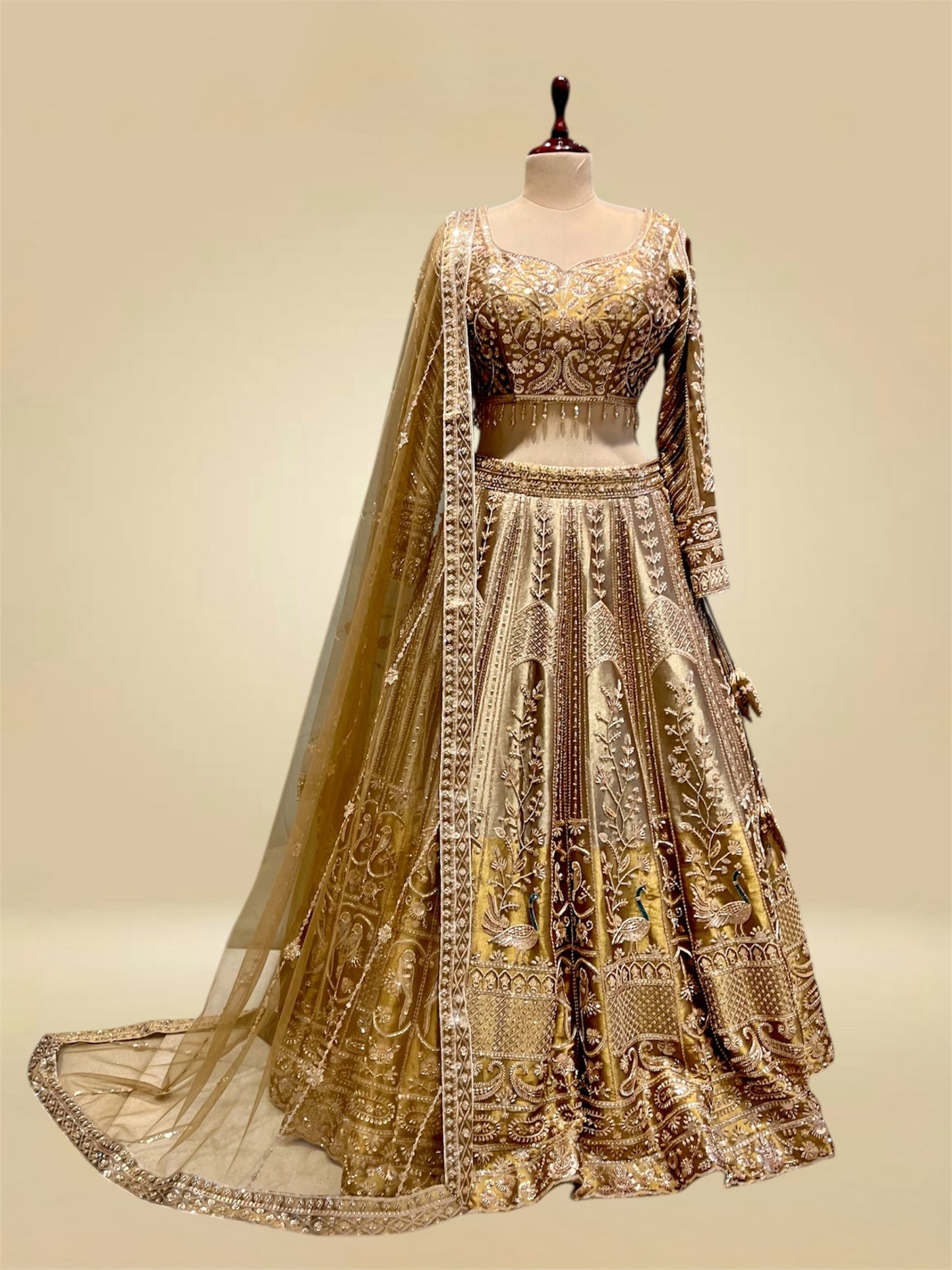 ANTIQUE GOLDEN TISSUE LEHENGA EMBELLISHED WITH SEQUINS, CUTDANA & RESHAM WORK