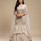 IVORY–GOLDEN FISHCUT LEHENGA WITH EMBROIDERED CROP TOP & NET CAPE