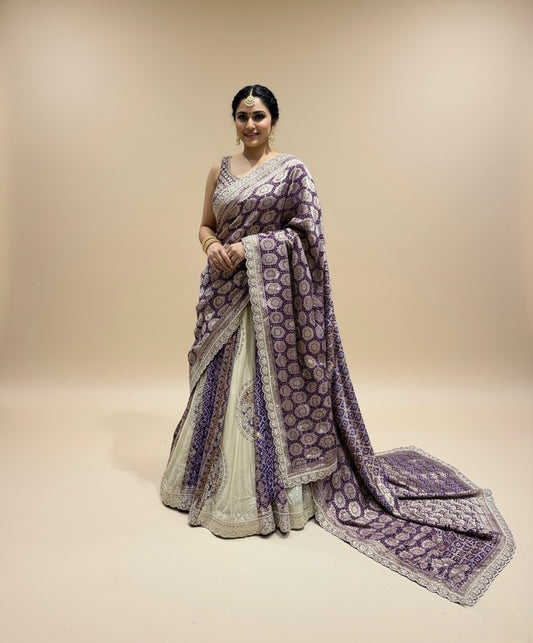 IVORY-PURPLE COLOUR TISSUE GEORGETTE BANDHANI LEHENGA EMBELLISHED WITH GOTA PATTI & ZARDOZI WORK