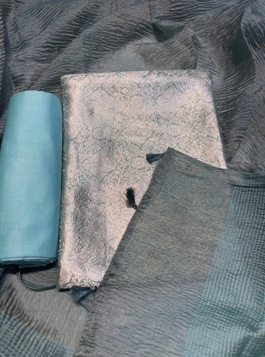 DUSTY TEAL BROCADE UNSTITCHED SUIT WITH CRUSHED TISSUE DUPATTA &CHANDERI SILK BOTTOM