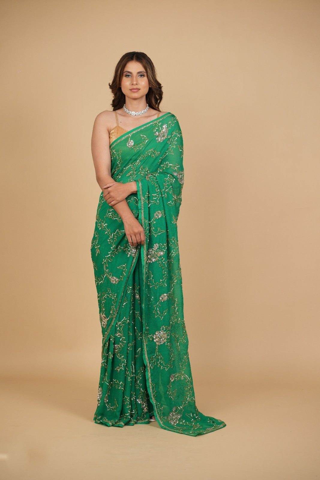 EMERALD GREEN PURE PLATINUM CHIFFON SAREE WITH SEQUINS JAAL HAND EMBROIDERY PAIRED WITH CREPE BLOUSE WITH EMBROIDERED SLEEVES