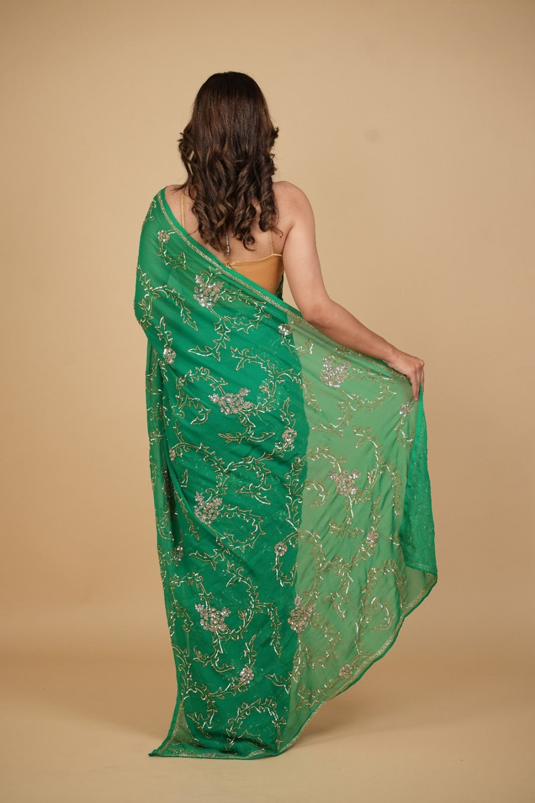 EMERALD GREEN PURE PLATINUM CHIFFON SAREE WITH SEQUINS JAAL HAND EMBROIDERY PAIRED WITH CREPE BLOUSE WITH EMBROIDERED SLEEVES