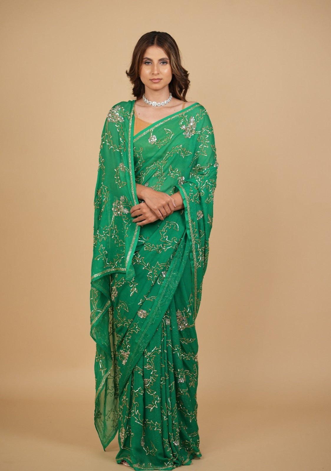 EMERALD GREEN PURE PLATINUM CHIFFON SAREE WITH SEQUINS JAAL HAND EMBROIDERY PAIRED WITH CREPE BLOUSE WITH EMBROIDERED SLEEVES