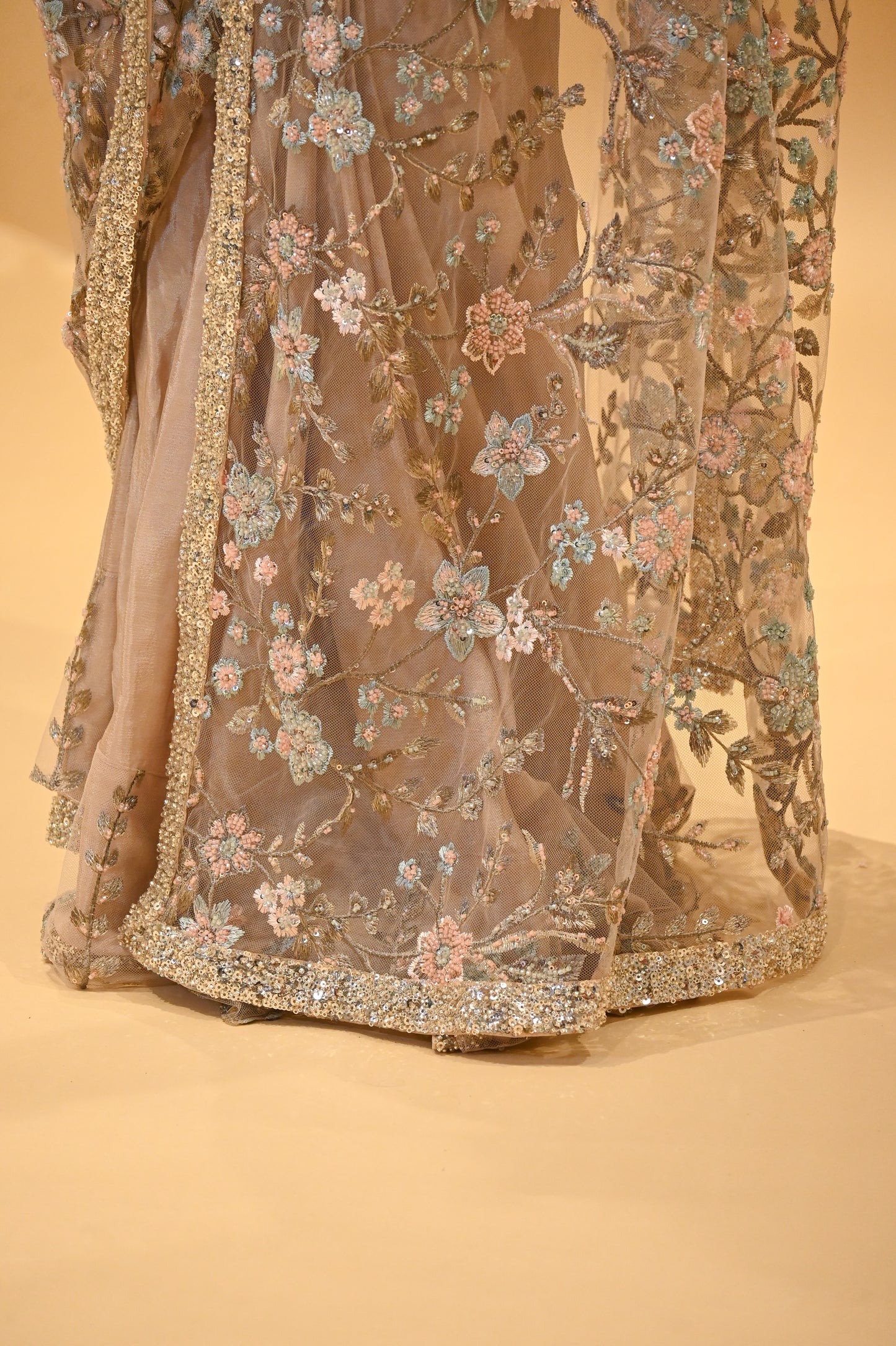 DUSTY ROSE BEIGE COLOUR FLORAL EMBROIDERED NET SAREE