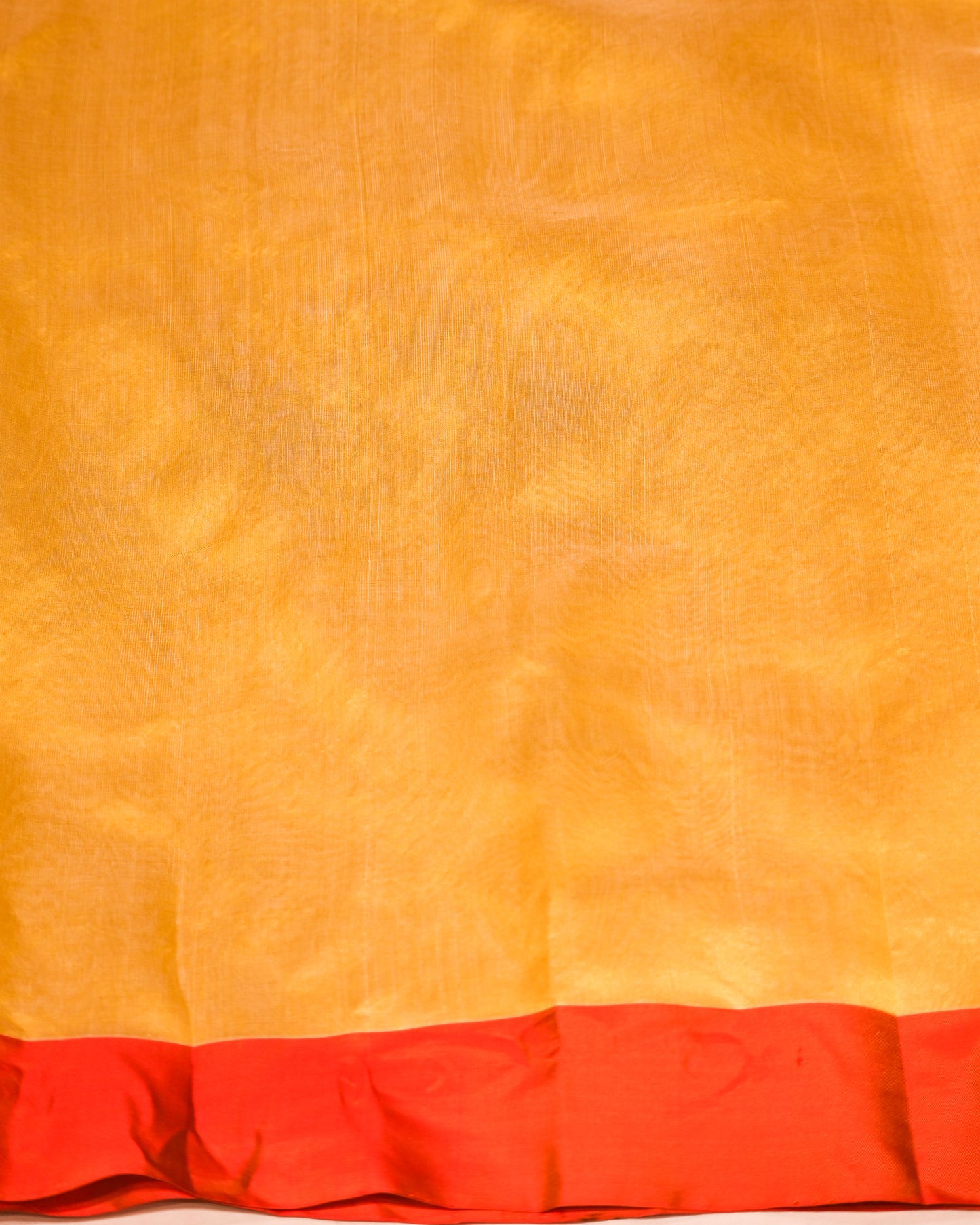 YELLOW CHANDERI HANDWOVEN SILK SAREE WITH CONTRAST ORANGE BORDER AND ZARI PALLA