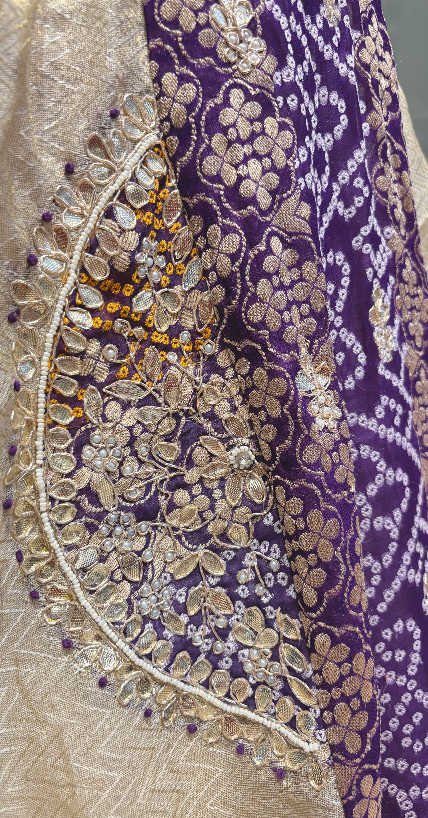 IVORY-PURPLE COLOUR TISSUE GEORGETTE BANDHANI LEHENGA EMBELLISHED WITH GOTA PATTI & ZARDOZI WORK