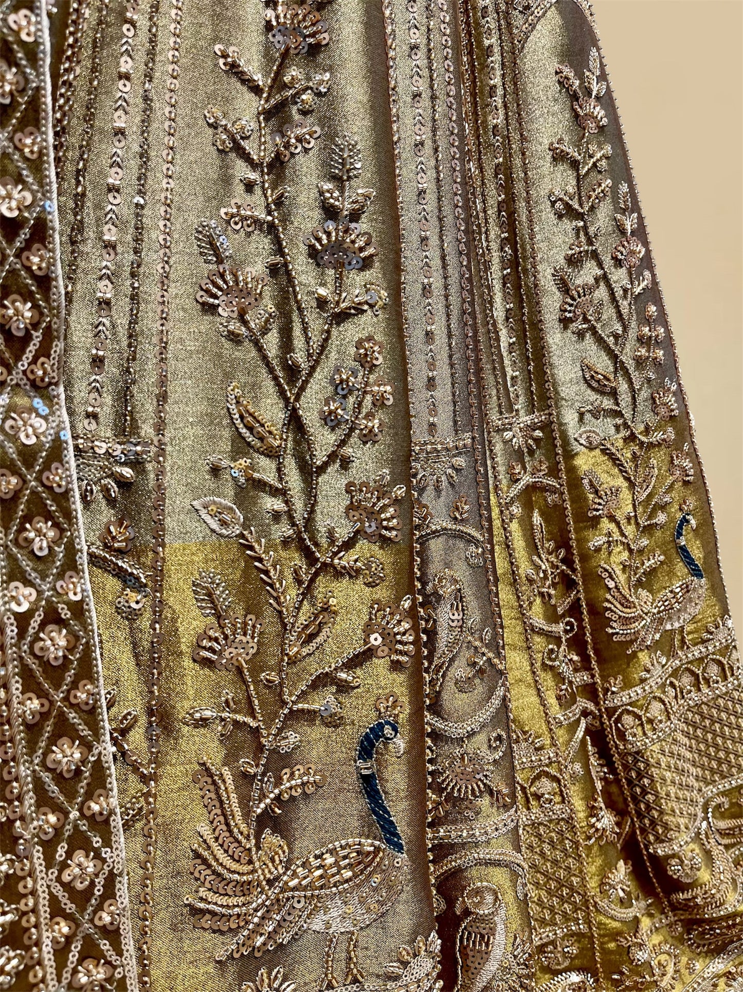 ANTIQUE GOLDEN TISSUE LEHENGA EMBELLISHED WITH SEQUINS, CUTDANA & RESHAM WORK