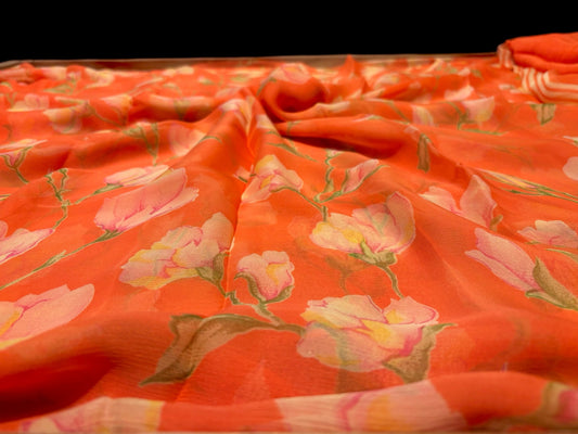 Coral colour printed chiffon saree with plain crepe blouse