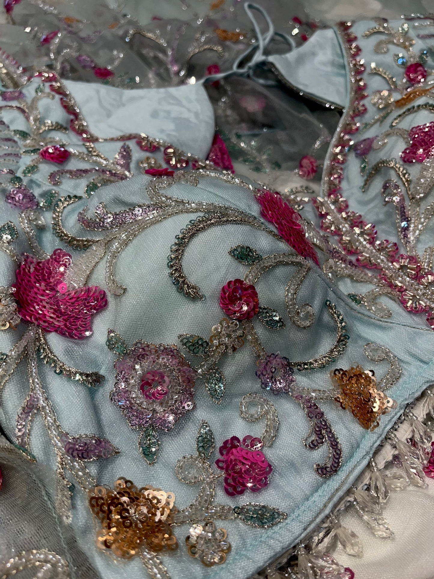 PASTEL BLUE NET SAREE  EMBELLISHED WITH SEQUINS & CUTDANA WORK PAIRED WITH A READYMADE BLOUSE