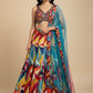 MULTICOLOURED DOLA SILK LEHENGA WITH NET DUPATTA AND CUTDANA & SEQUINS EMBELLISHED BLOUSE