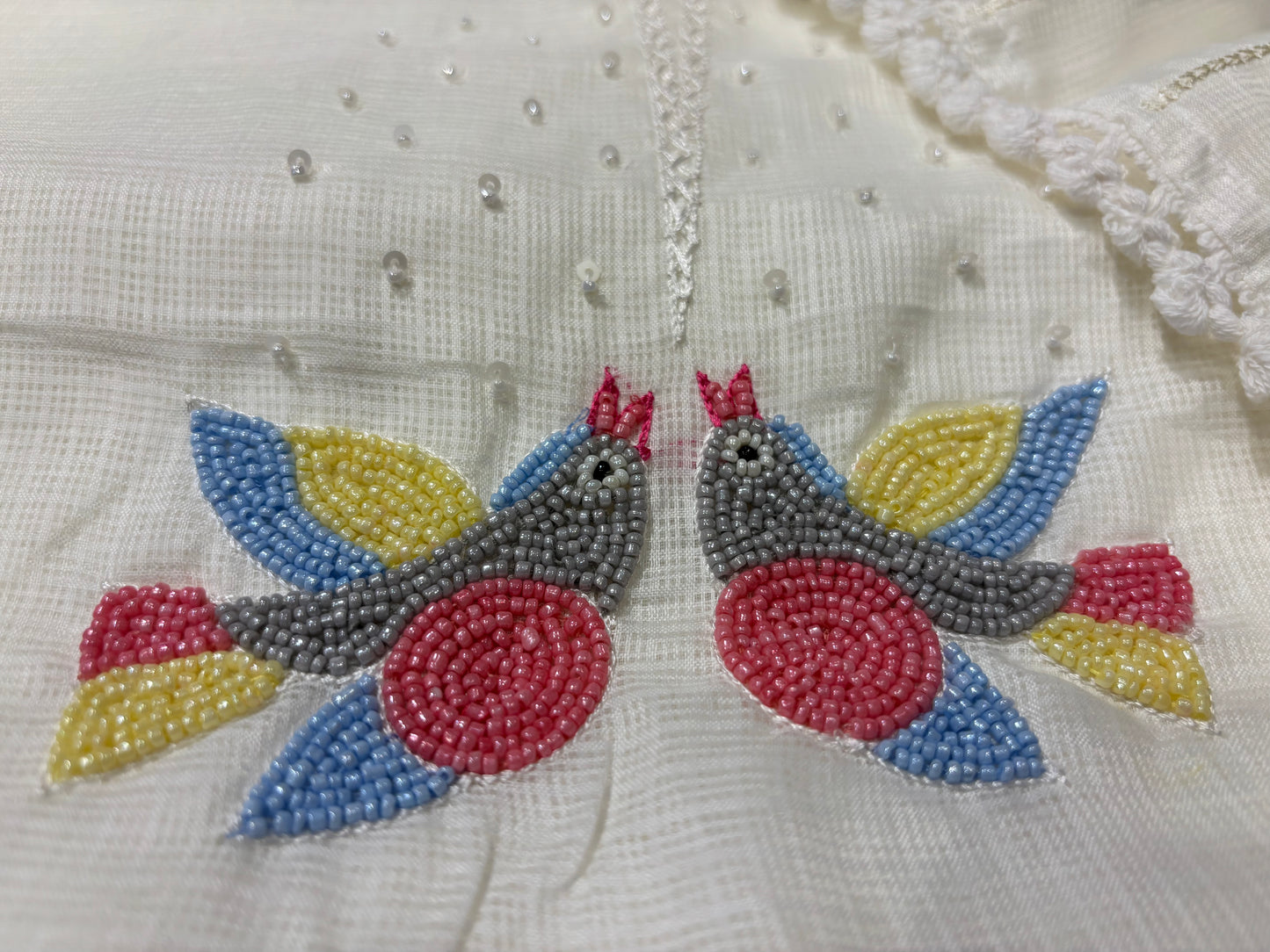 OFF WHITE KOTA DORIYA UNSTITCHED SUIT WITH RESHAM EMBROIDERED BIRD MOTIFS DUPATTA AND BEAD WORK KURTA
