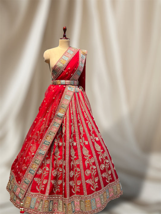 RED COLOUR SILK BRIDAL EMBROIDERED LEHENGA WITH UNSTITCHED BLOUSE & NET DUPATTA EMBELLISHED WITH  ZARDOZI AND BEAD WORK