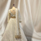 IVORY COLOUR NET HAND EMBROIDERD CROP TOP LEHENGA EMBELLISHED WITH CUTDANA & SEQUINES WORK