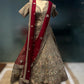 GOLDEN MATTE FINISH ZARI LEHENGA WITH READY MADE BLOUSE AN RED CONTRAST SCULPING BOARDER DUPATTA PAIRED WITH ONE EXTRA RED DUPATTA