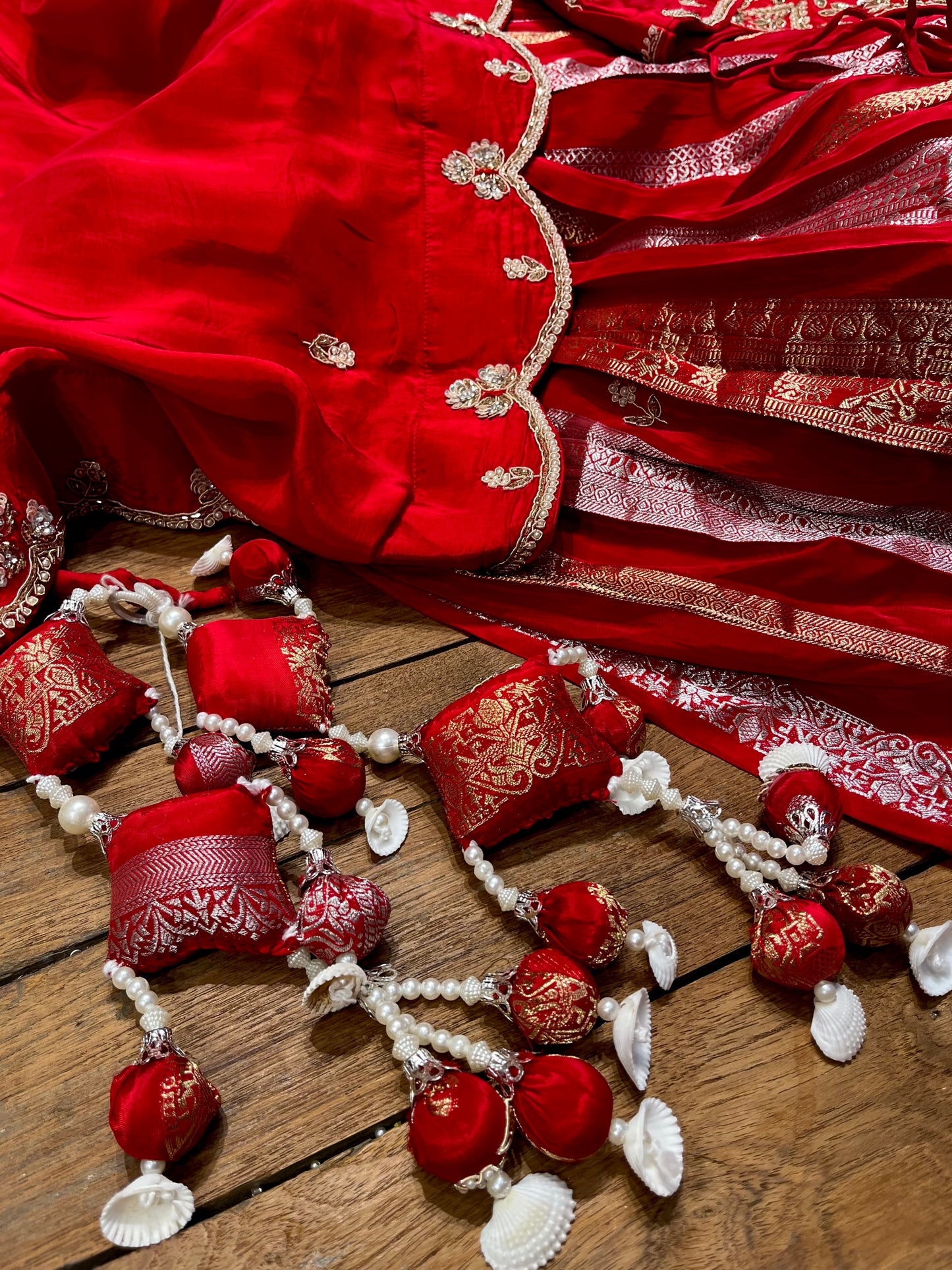 RED COLOUR CREPE SILK ZARI STRIPES LEHENGA WITH EMBROIDERED BLOUSE & SCALLOP DUPATTA EMBELLISHED WITH ZARDOZI, PEARL & CUTDANA WORK