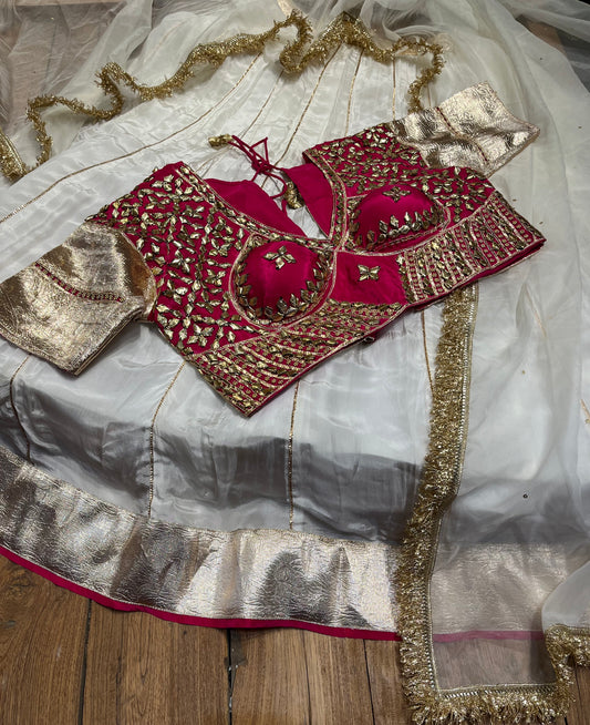 WHITE COLOUR CREPE SILK LEHENGA WITH CONTRAST READYMADE BLOUSE & ORGANZA DUPATTA EMBELLISHED WITH GOTA PATTI WORK