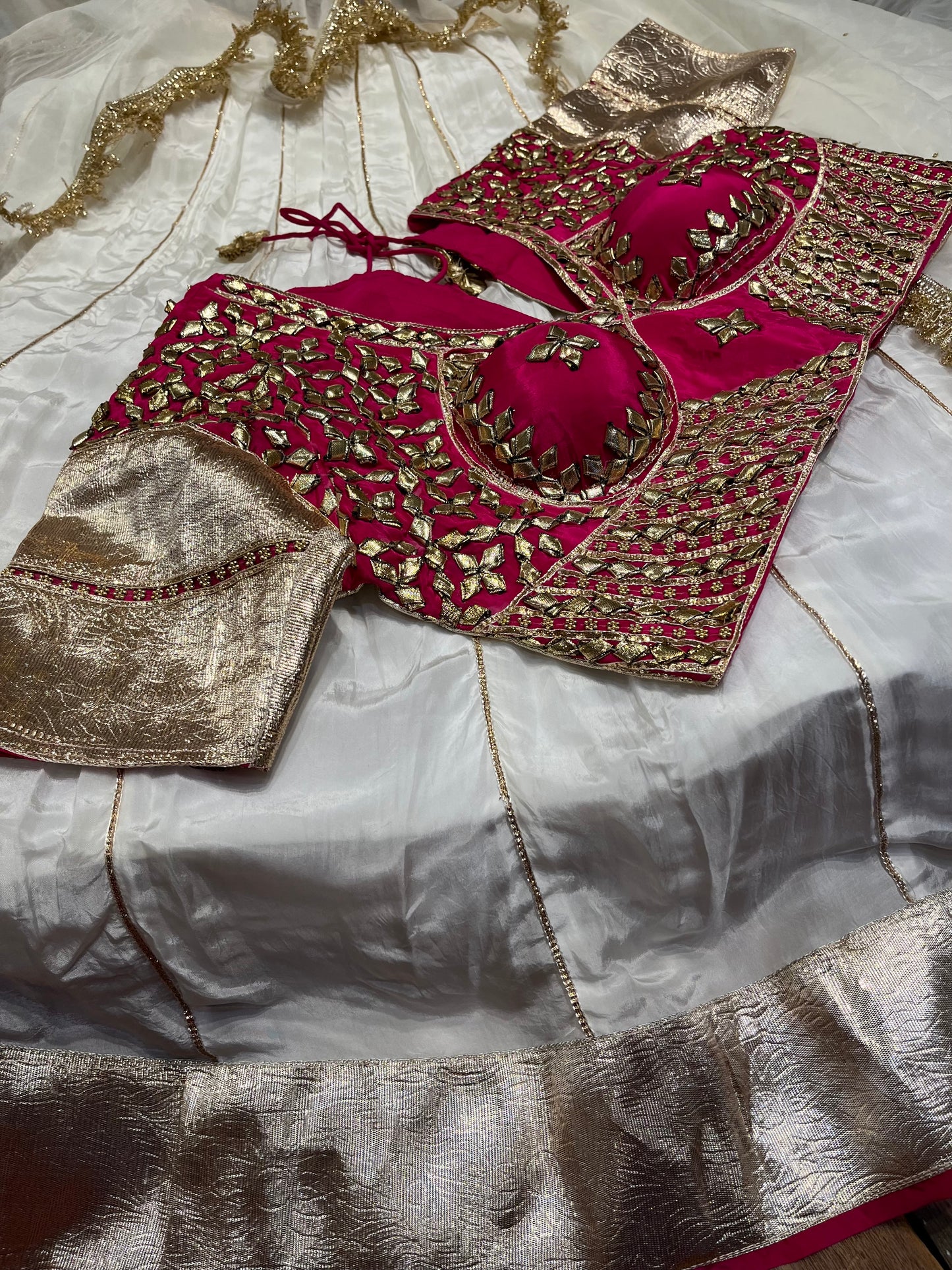 WHITE COLOUR CREPE SILK LEHENGA WITH CONTRAST READYMADE BLOUSE & ORGANZA DUPATTA EMBELLISHED WITH GOTA PATTI WORK