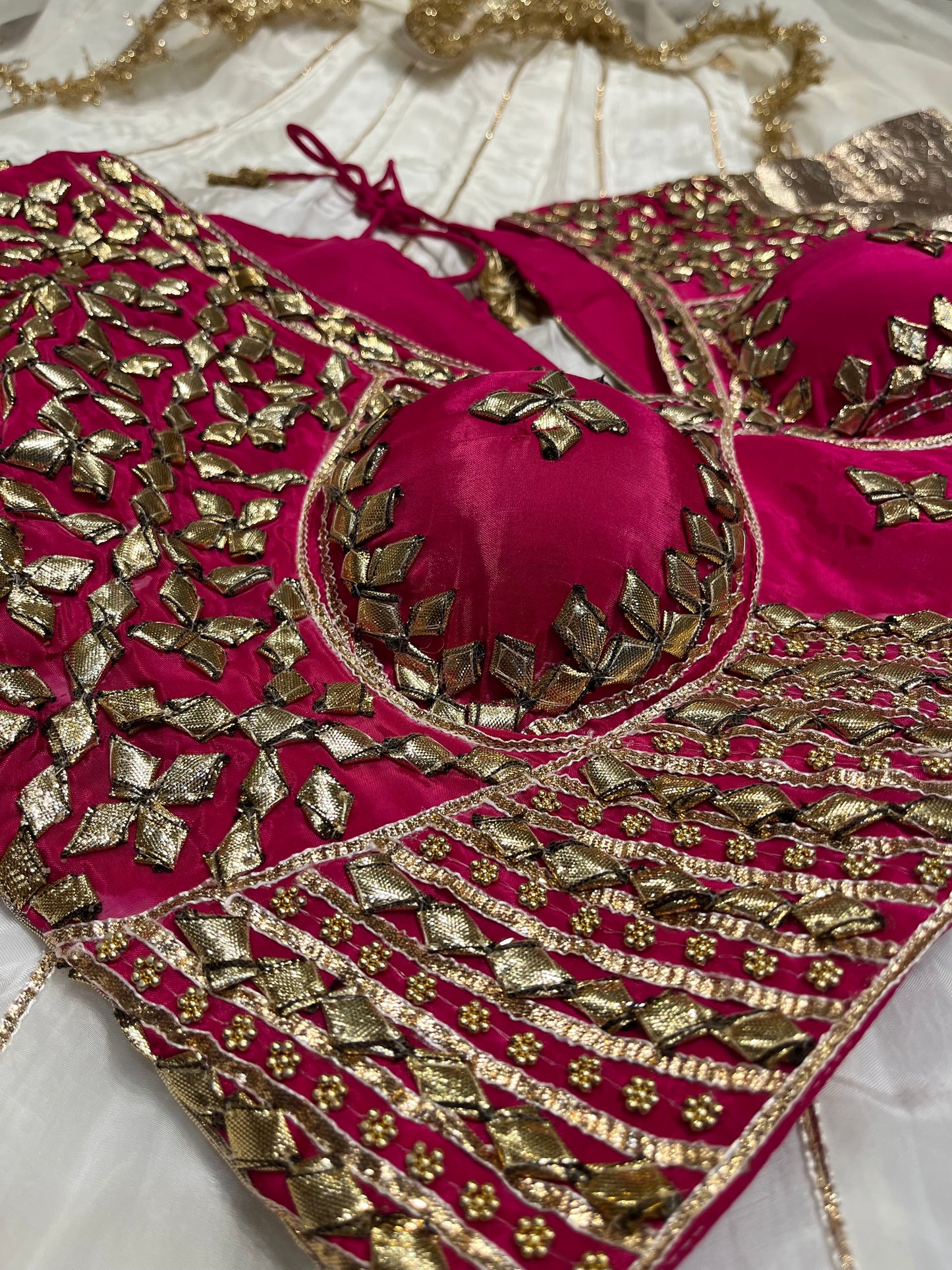 WHITE COLOUR CREPE SILK LEHENGA WITH CONTRAST READYMADE BLOUSE & ORGANZA DUPATTA EMBELLISHED WITH GOTA PATTI WORK