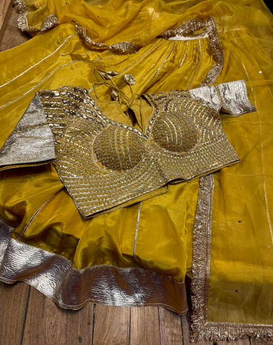 MUSTARD COLOUR CREPE SILK LEHENGA WITH READYMADE BLOUSE & ORGANZA DUPATTA EMBELLISHED WITH GOTA PATTI WORK