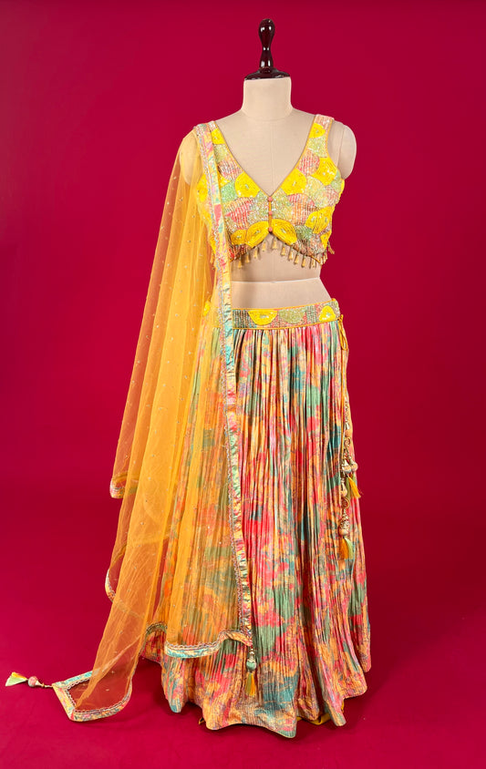 MULTI COLOUR CREPE SILK SEQUINS SKIRT WITH EMBROIDERED BLOUSE & NET DUPATTA EMBELLISHED WITH CUTDANA & SEQUINS WORK