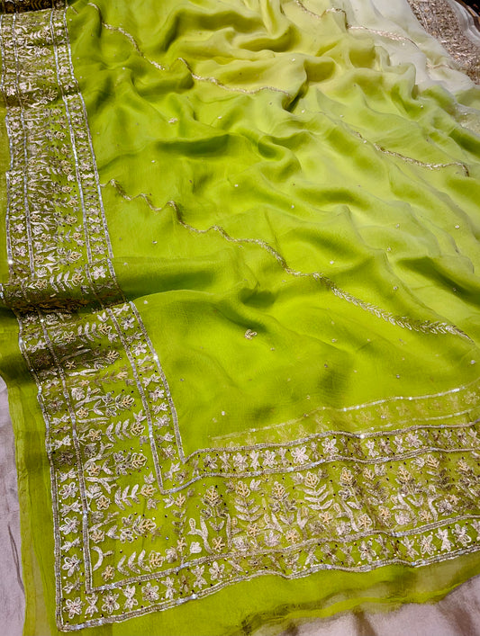 PARROT GREEN COLOUR PURE CHIFFON HAND EMBROIDERED SAREE EMBELLISHED WITH SEQUINS,RESHAM AND BEADS WORK