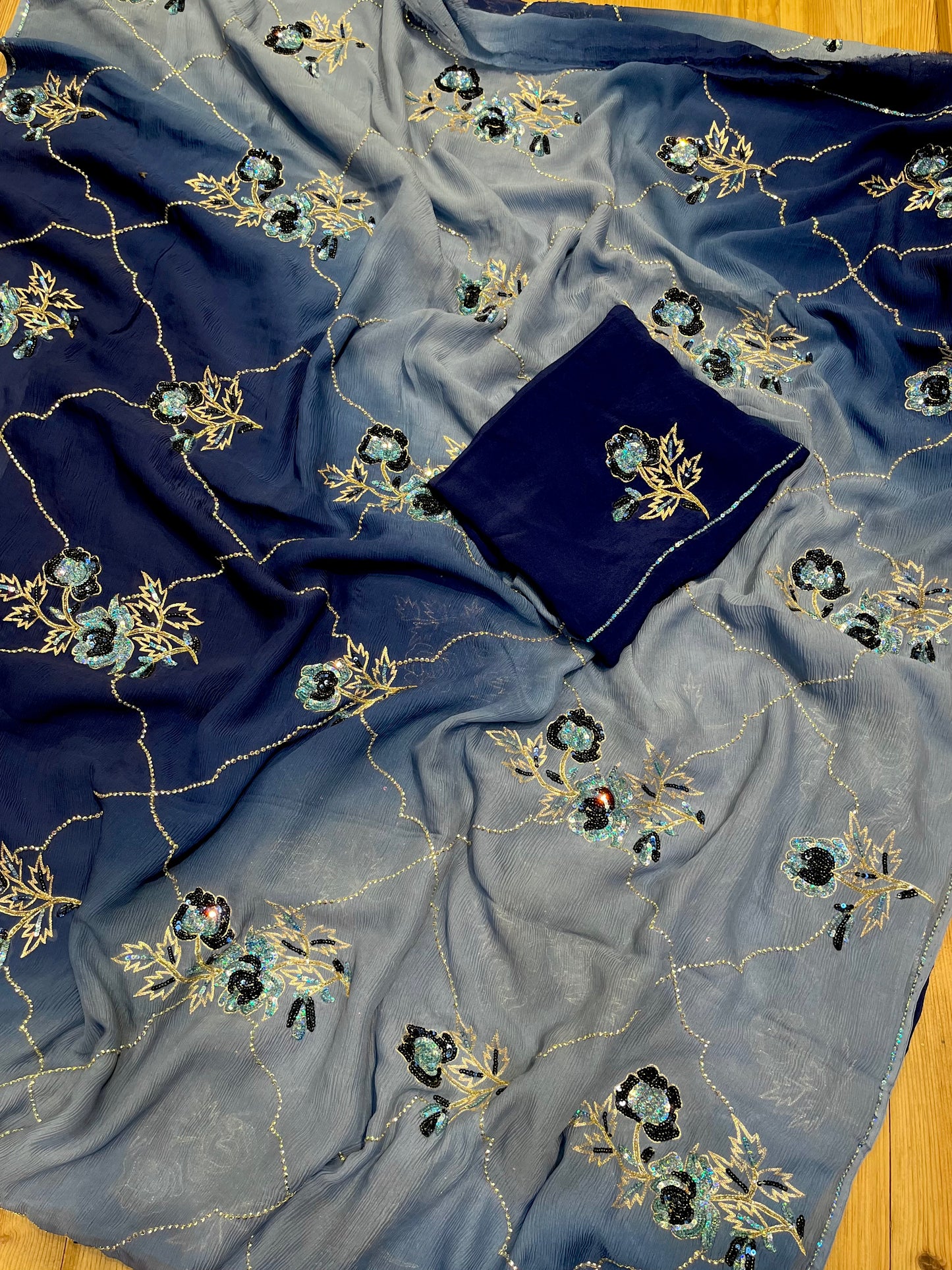 ( DELIVERY IN 20-25 DAYS ) BLUE SHADED PURE CHIFFON HAND EMBROIDERED SAREE EMBELLISHED WITH SEQUINS, CUTDANA & AARI WORK