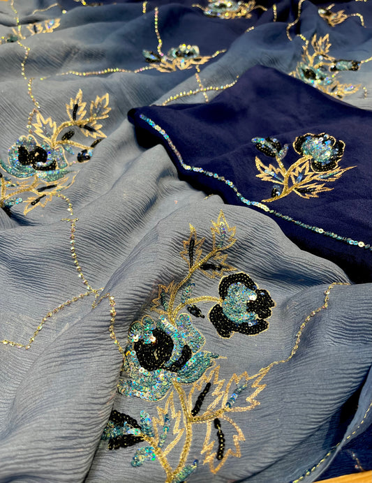 ( DELIVERY IN 20-25 DAYS ) BLUE SHADED PURE CHIFFON HAND EMBROIDERED SAREE EMBELLISHED WITH SEQUINS, CUTDANA & AARI WORK