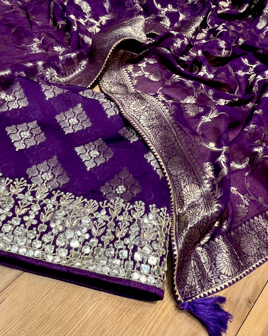 ( DELIVERY IN 15-20 DAYS ) PURPLE COLOUR ORGANZA SILK BANARASI UNSTITCHED SUIT EMBELLISHED WITH GOTA PATTI WORK