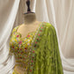 LEMON YELLOW LEHENGA WITH GREEN DUPATTA, SILK FABRIC, & RESHAM WORK EMBELLISHED WITH BEADS & TASSELS