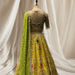 LEMON YELLOW LEHENGA WITH GREEN DUPATTA, SILK FABRIC, & RESHAM WORK EMBELLISHED WITH BEADS & TASSELS