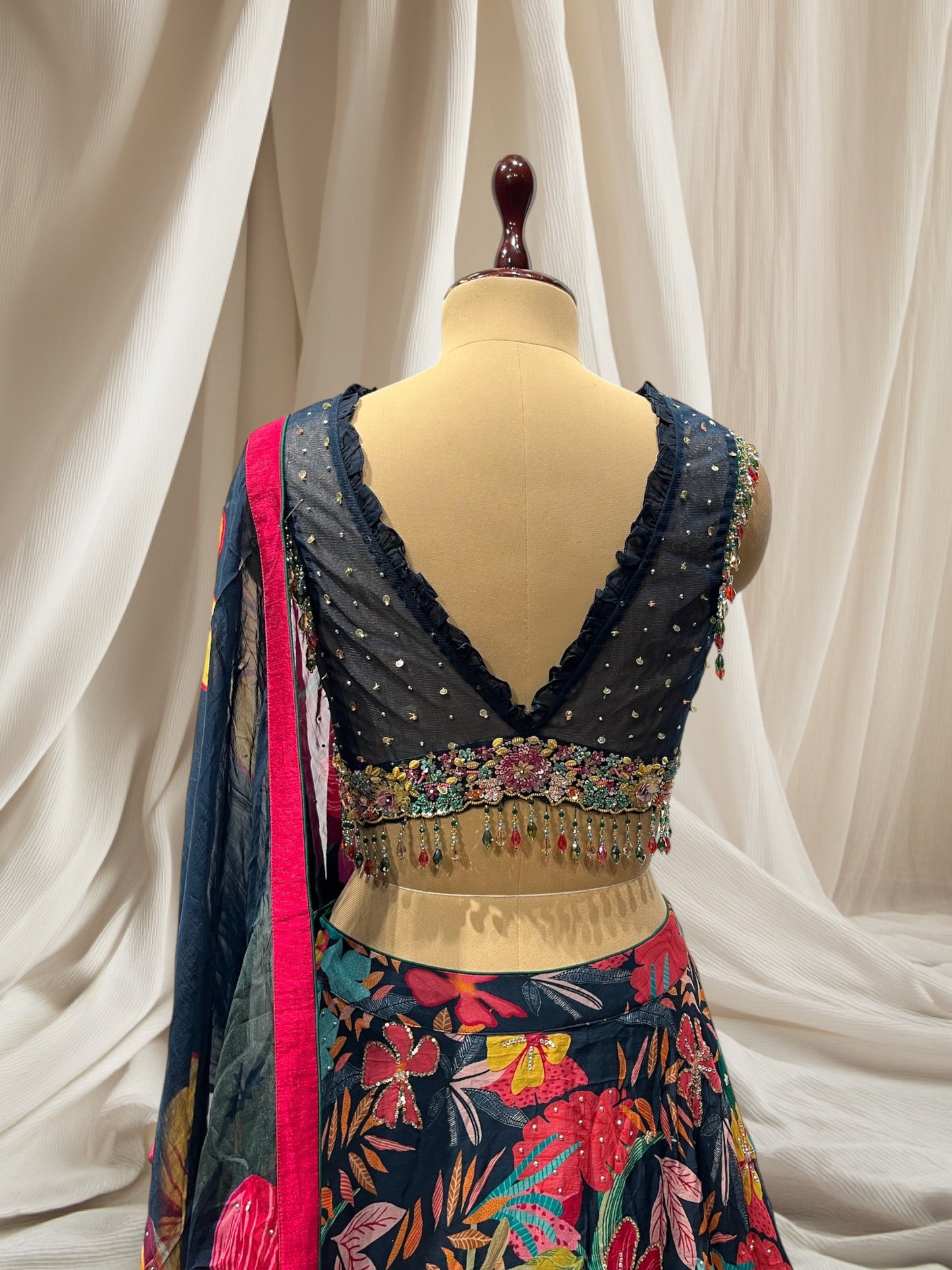 NAVY BLUE COLOUR, MULTI COLOR PRINT ORGANZA LEHENGA WITH V NECK CROP TOP & ORGANZA DUPATTA EMBELLISHED WITH BEADS & SEQUINS TASSELS