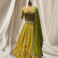 LEMON YELLOW LEHENGA WITH GREEN DUPATTA, SILK FABRIC, & RESHAM WORK EMBELLISHED WITH BEADS & TASSELS