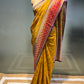 MUSTARD COLOUR GEORGETTE TISSUE SAREE EMBELLISHED WITH ZARI WEAVES