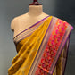 MUSTARD COLOUR GEORGETTE TISSUE SAREE EMBELLISHED WITH ZARI WEAVES