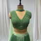 GREEN COLOR, SILK LEHENGA WITH V-NECK CROP TOP & NET DUPATTA EMBELLISHED WITH SEQUINS EMBROIDERY