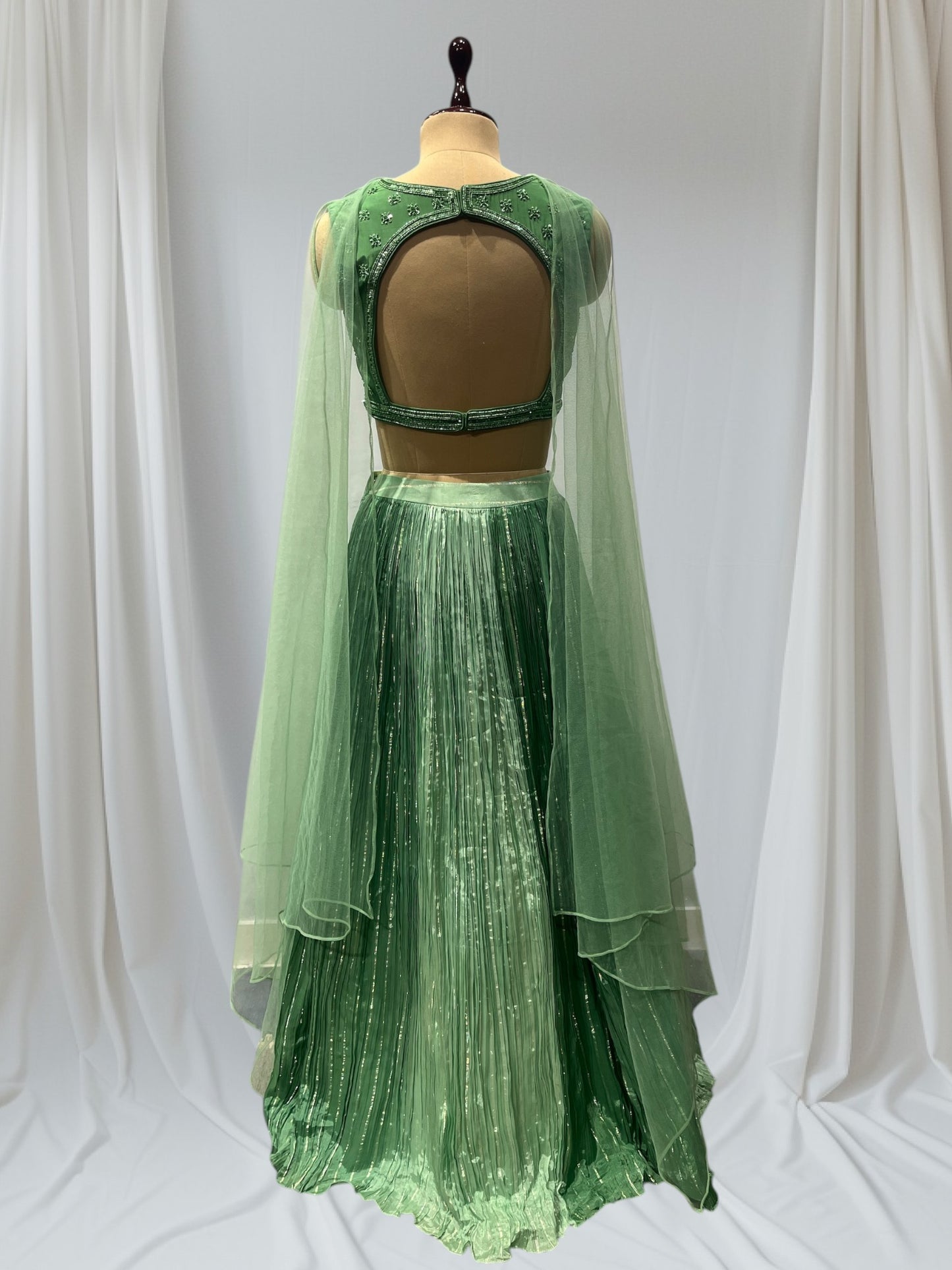 GREEN COLOR, SILK LEHENGA WITH V-NECK CROP TOP & NET DUPATTA EMBELLISHED WITH SEQUINS EMBROIDERY